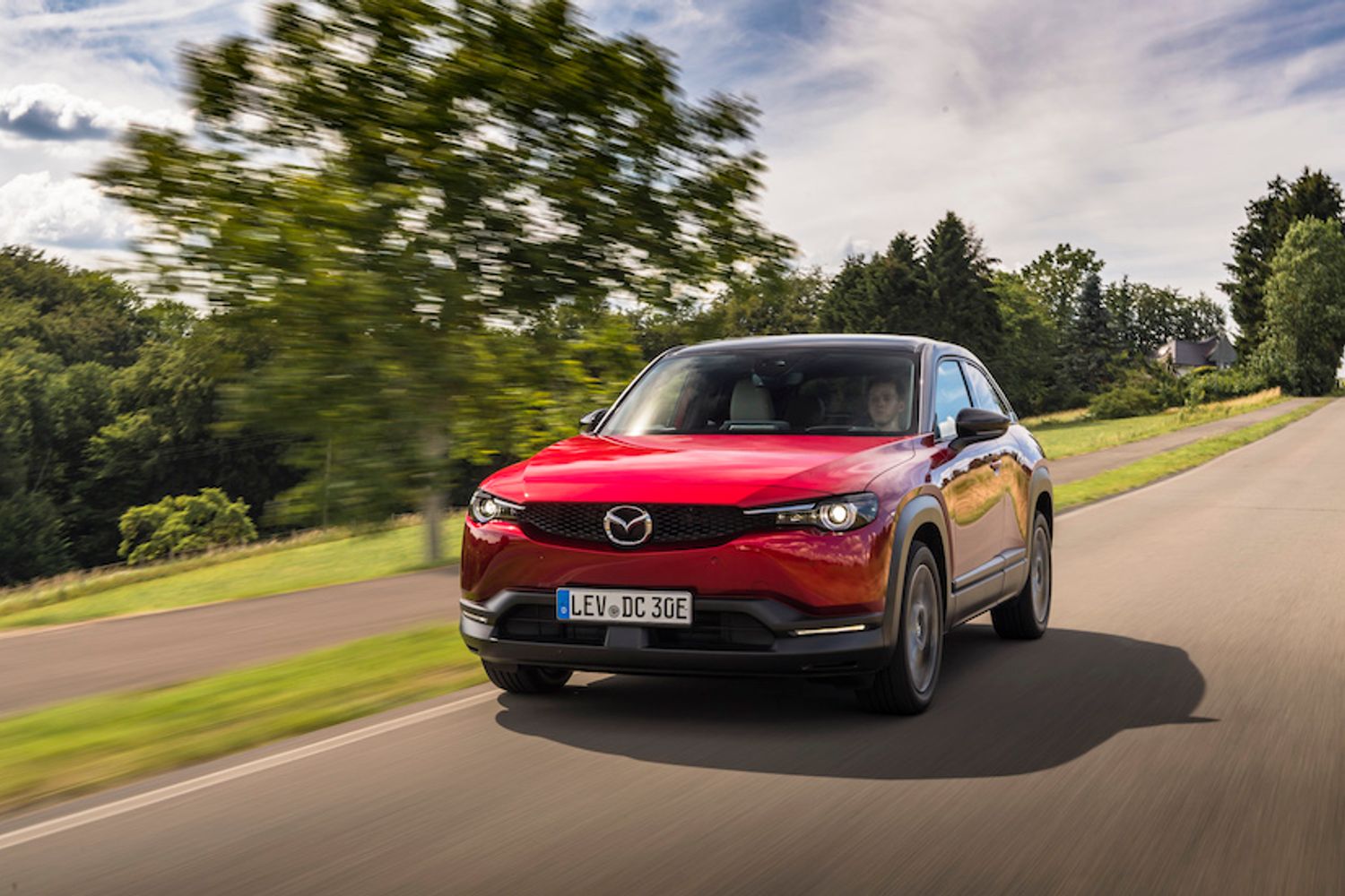 Red Mazda CX30 front driving